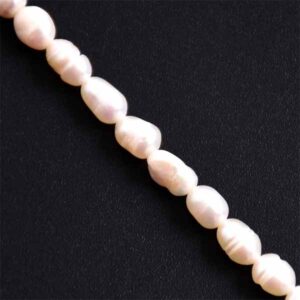 107- Perla de Rio Blanca Arroz 6-7mm- 34cm aprox. (1 tira)